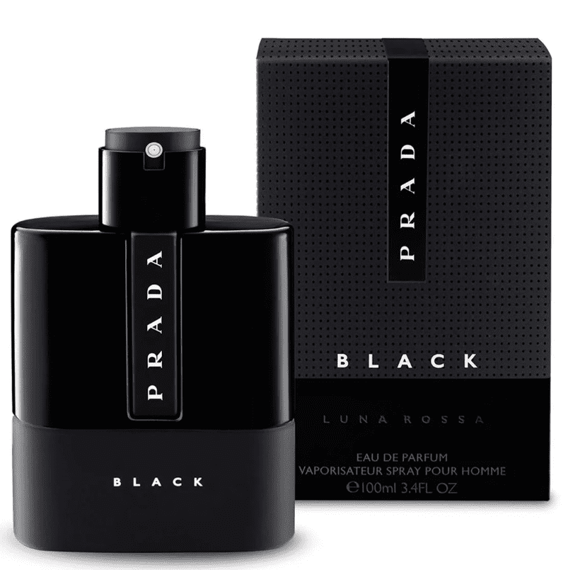 A black bottle of perfume in front of a box.