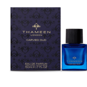 A blue bottle of perfume next to its box.