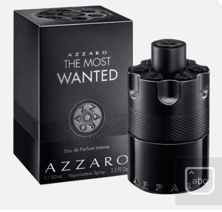 A black bottle of perfume sitting next to its box.