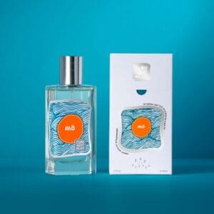 A bottle of perfume next to its packaging.