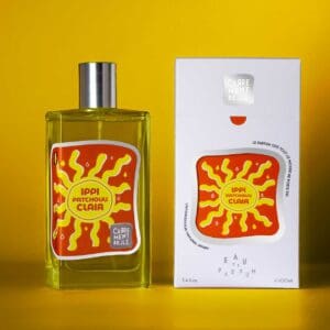 A bottle of sun flower scent next to its box.