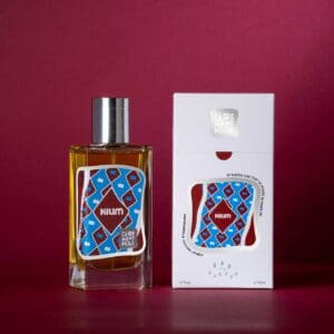 A bottle of perfume next to its box.