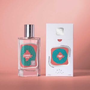 A bottle of perfume next to its box.