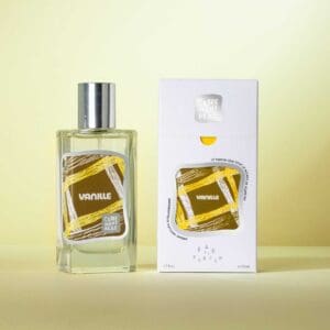 A bottle of perfume next to its packaging.