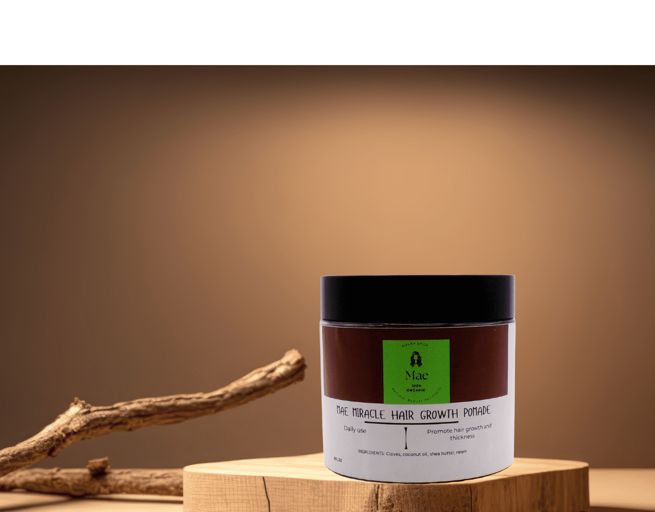 Hair growth product on wooden surface display.