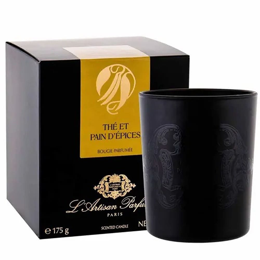 Black scented candle with elegant packaging.